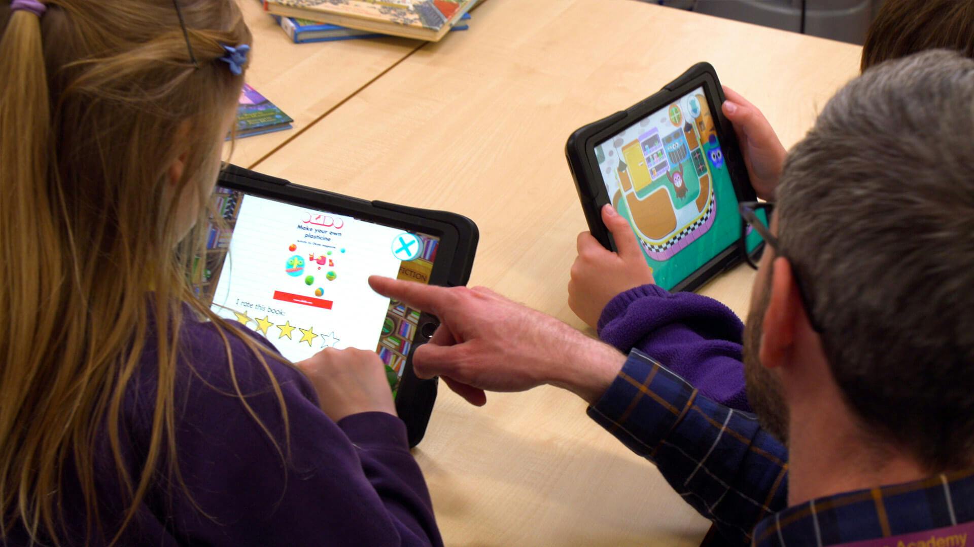 Kids using Reading for Fun with their teacher