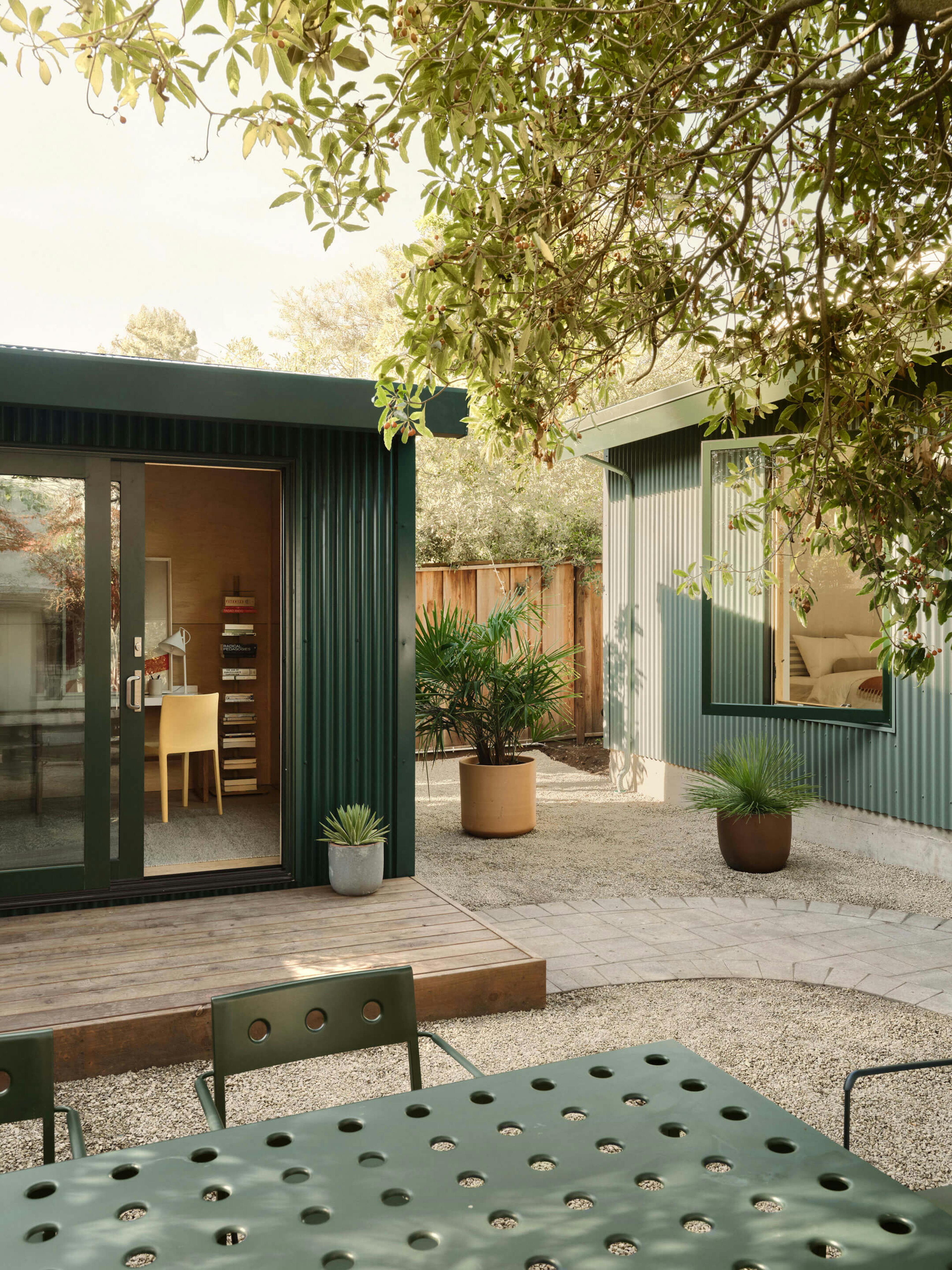 Detail exterior shot of Type Five backyard ADU and Pod products with landscaping