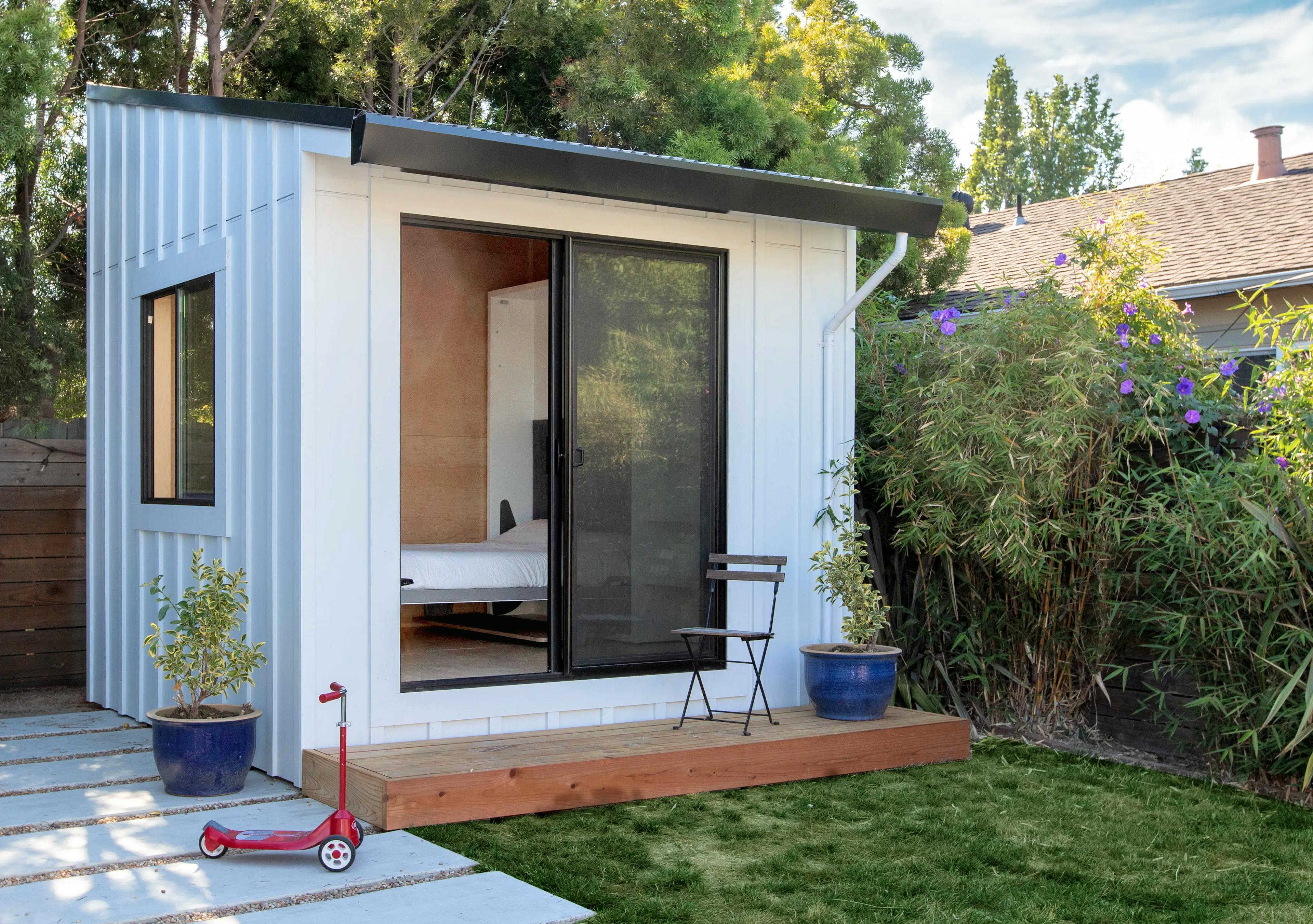A white Type Five Pod studio with black trim