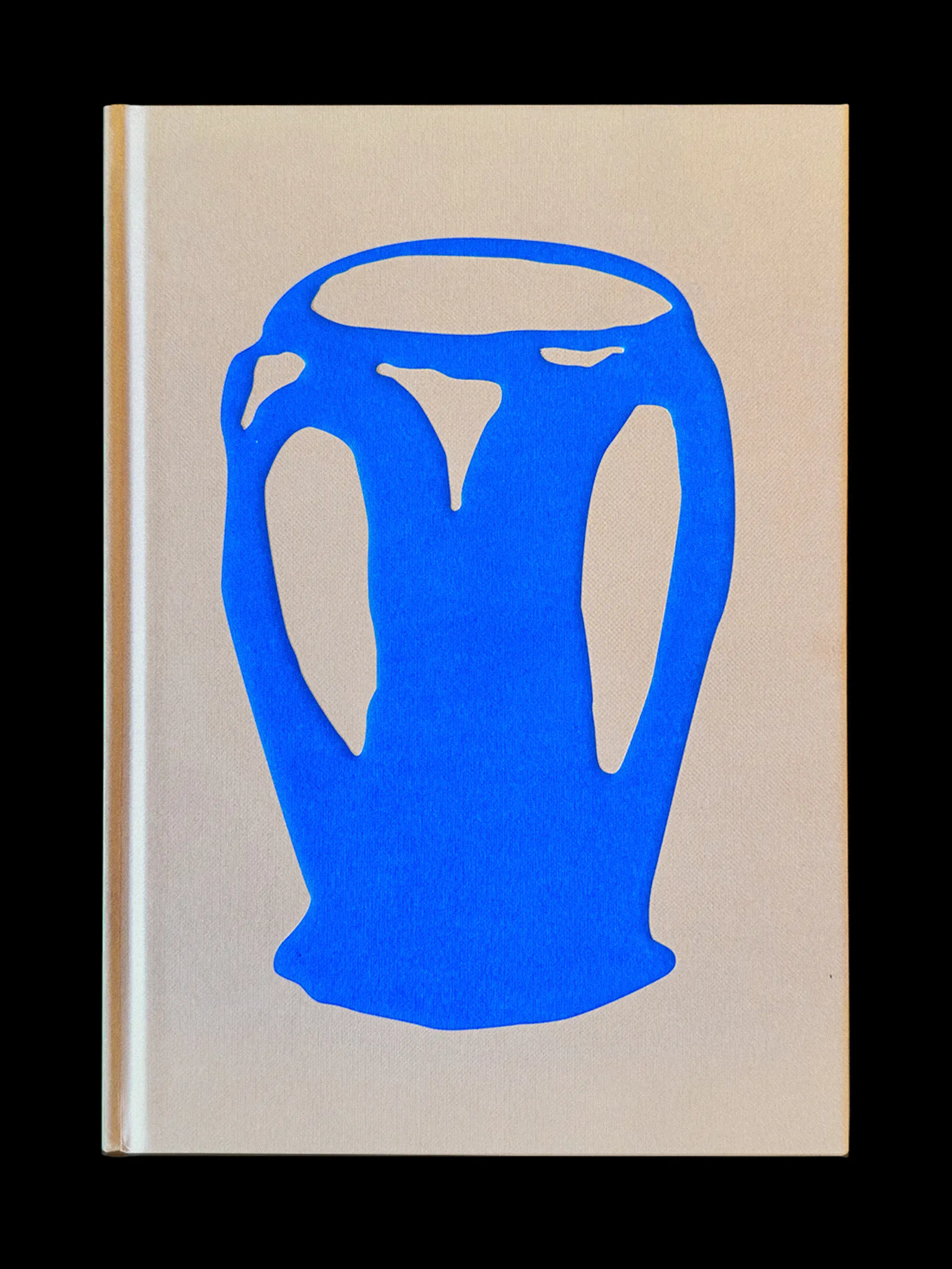 Publication cover for Fantastic Forms at Bundanon. A pale cream hardcover book stands against a black background, featuring a bold, simplified bright blue illustration of a two-handled vase or urn rendered in a loose, hand-cut style. U-P(co)2010