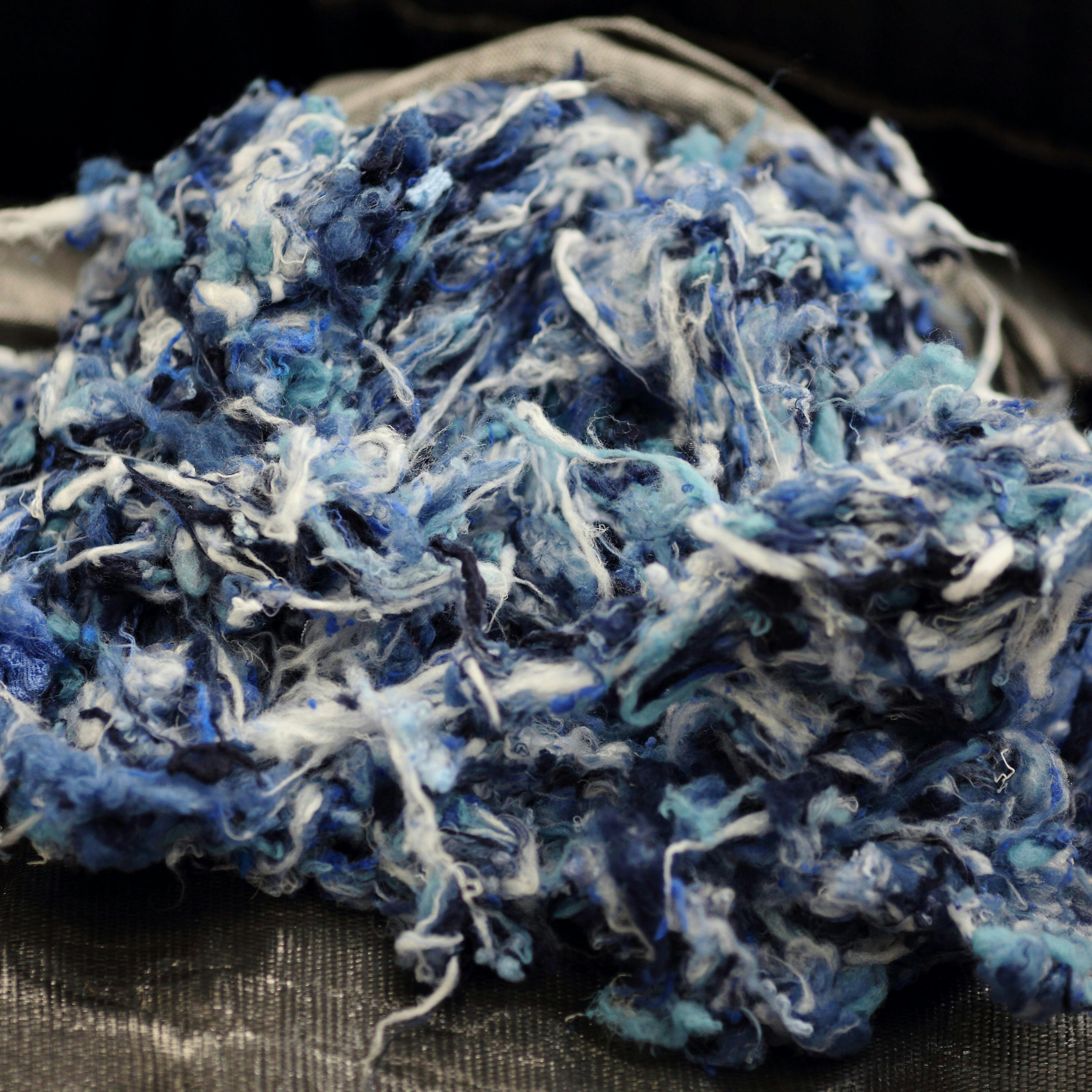 Laine défibrée prête à être recyclée