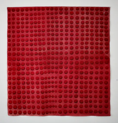 Large unstretched painting made with tones of red acrylic paint depicting 506 red spheres, slightly varying in size, and organized into rows and columns