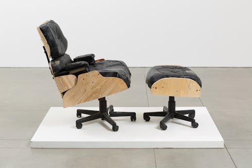 Photograph of a replica Eames Lounge Chair made from deconstructed used office chairs.