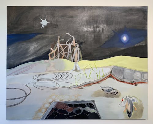 A 6 foot by 7 and a half foot oil on canvas painting. This landscape painting has a dark black sky, with gestural blue brushwork and white stars. A driftwood hut sits at the center atop a yellow-purple sand dune, and is bisected by a white storm drain. This funnels into the foreground of the painting. To the right is an incomplete gray sidewalk, to the left are gray (car) donuts, and at the center are bent shards of chartreuse-colored grass. At the lower right hand corner, there are two deceased animals, one fish and one duck. At the bottom middle of the foreground is a black and red pit of rocks that extends beyond the bottom of the canvas. 