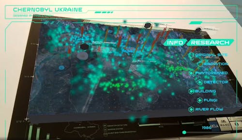 a 3d typology model of Chernobyl, with an animation of green floating fungi, and flowing river.