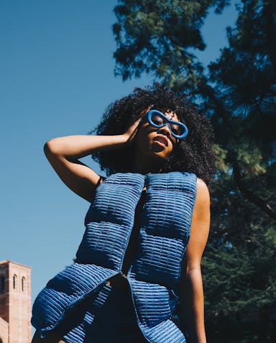 Female posing in front of Jann Steps at UCLA for the Hip-Hop Congress Fashion Show 2024