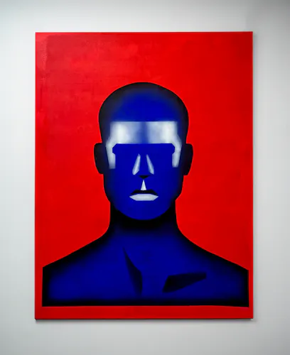 This is an Acrylic Painting on Canvas, with a vibrant solid red background, there is a bust centered in the painting, it is a deep vibrant blue with white and black geometric airbrushing to define the features of the face, neck, and upper chest. the figure has no eyes but has a striking white forehead. It looks robotic and futuristic but has some assemblage of humanity stripped from it.