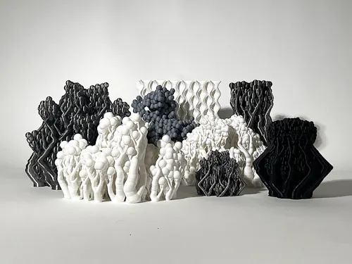 This research program explores a bio-inspired architectural facade system that uses protein spatial aggregation logic combined with 3D printing to address privacy and fire escape exposure on the rear elevation of The Trust Building in Downtown Los Angeles. Using ‘amino acid’ modules and protein-like growth behavior, the design introduces a spatially layered system capable of shading, extending slabs, and creating visual depth.