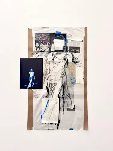 A variety of paper clippings and photos from newspapers that have been drawn on with black charcoal, pencil and blue color pencil collaged together to create a figure. A print of artist, María from the band The Marias, looking at the camera while on stage to the left..  