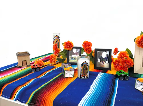 Homage to my dead childhood; Instalation of a Dia de los Muertos Alter using archival images of my childhood. 