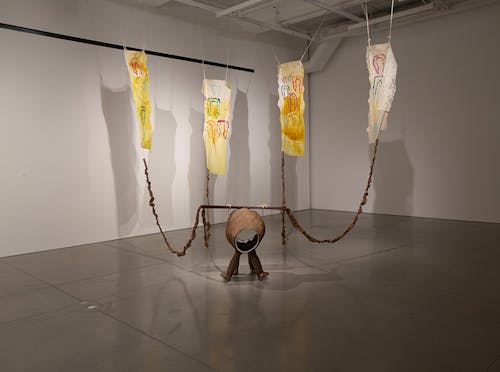 Butt hole creature Turmeric, Textile Linen, Latex, wood, ceramic, and beets. Installation 156”x 240”