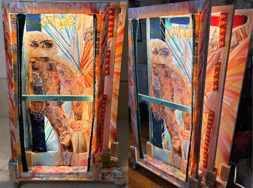 The piece titled "Ink Authorization" is an installation of three canvas layered on top of one another. The focal point is a person that is made out of photos of tattoos, surrounded by painted skin color. The background shows a puppeteer hand and a hand holding a tattoo gun coming together in the grey middle, exploding into blue and green on the left, and red and orange on the right. The canvas are also covered in woven yarn as frames. 