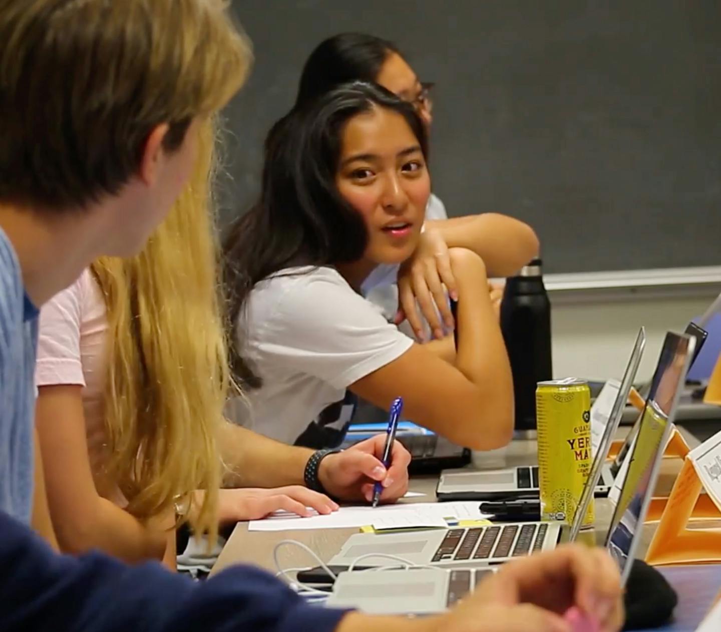 students chatting in a classroom