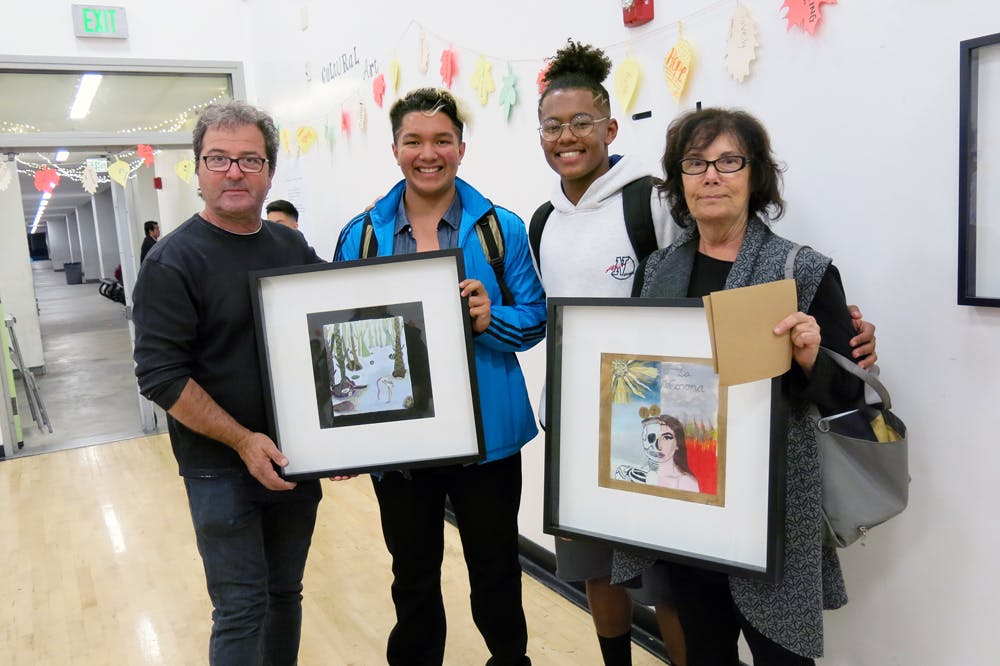 Barbara Drucker, Associate Dean, Community Engagement &amp; Arts Education, and her husband Christos Dimopoulos, purchased works by UCLA Community School students Arturo Castillo (at left) and Jacadi White.  Drucker is also the Founding Director, Visual and Performing Arts Education Program 