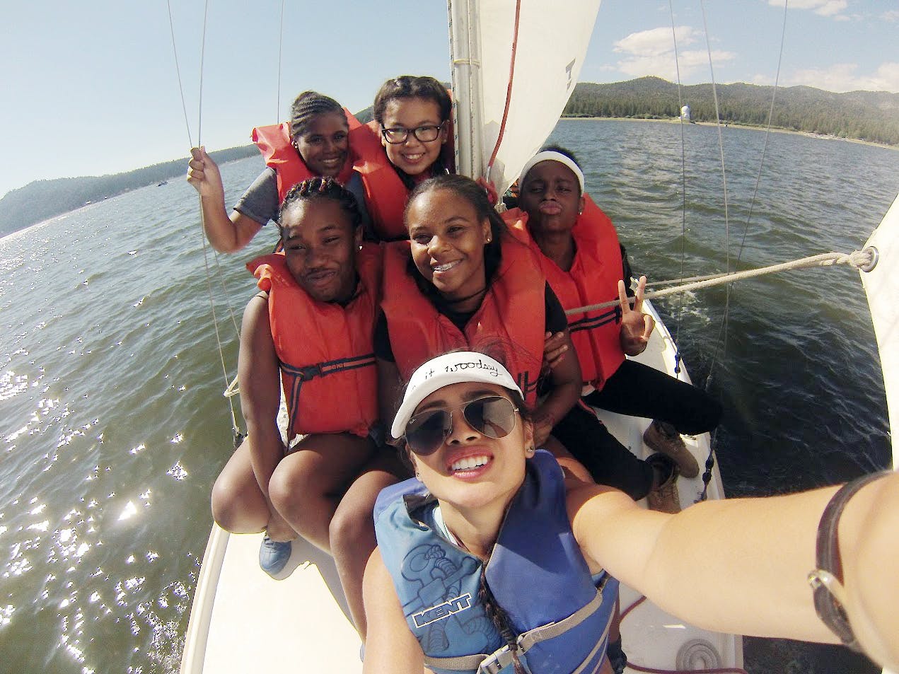Students from the Mann-UCLA Summer Institute and the UCLA Community School in Koreatown enjoy sailing on Big Bear Lake. 