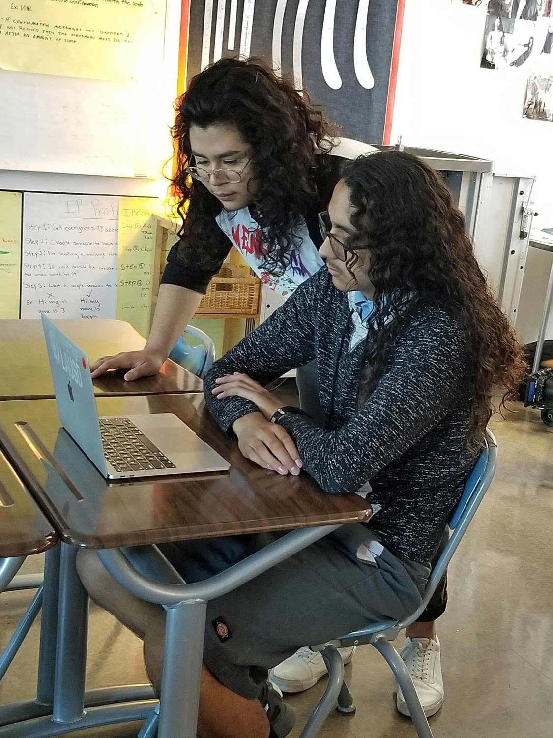 LAUSD students looking at a laptop