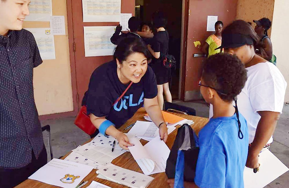 Sarah Bang, former liaison to UCLA Community Schools, welcomed South L.A. students to the Summer Institute at Horace Mann Middle School earlier this year. Photo by Christine Shen