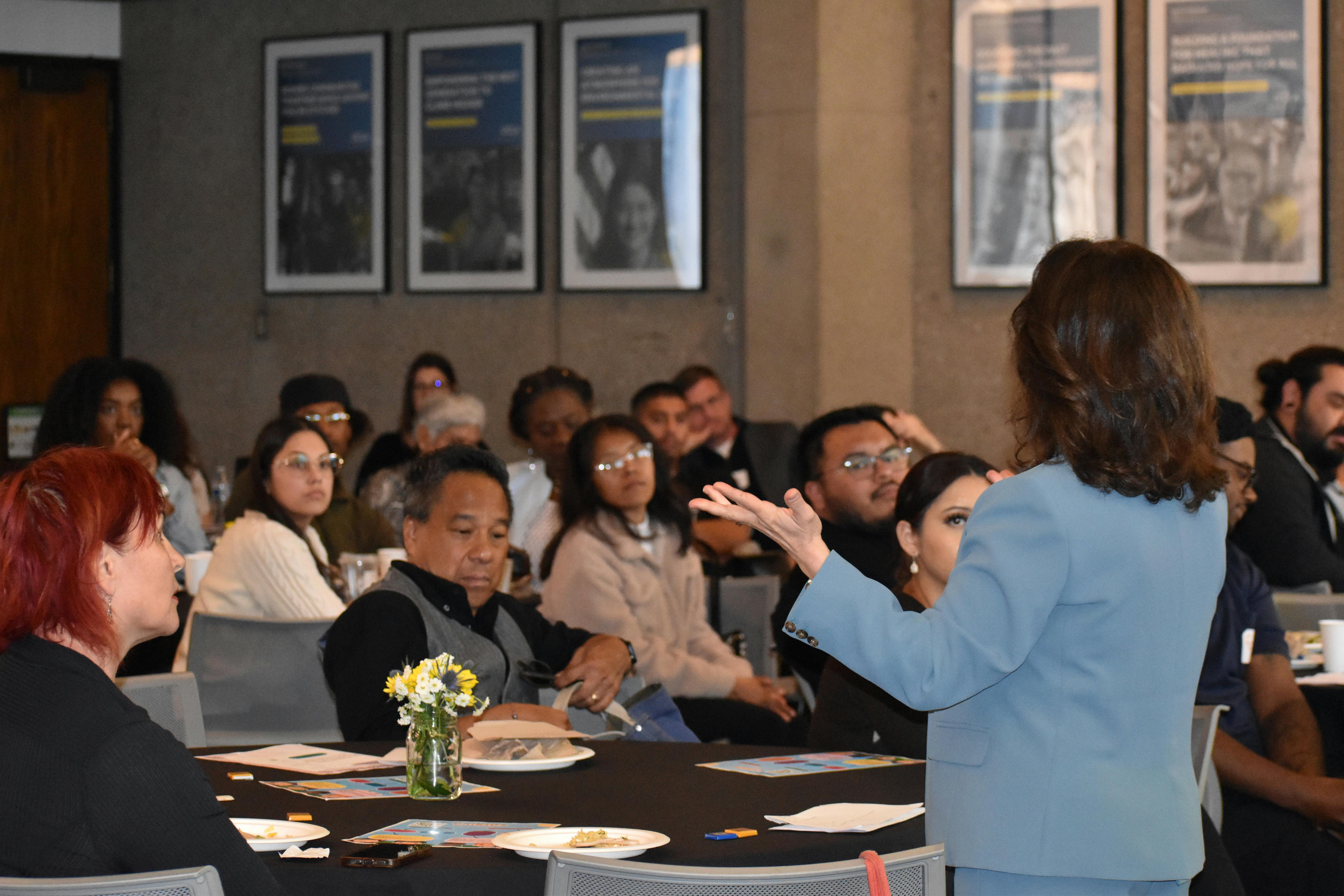 The Executive Director of UCLA CalKIDS Institute, Nayiri Nahabedian, welcomes guests at the ‘Securing Our Future: Financially Empowering the New Generation’ event. 