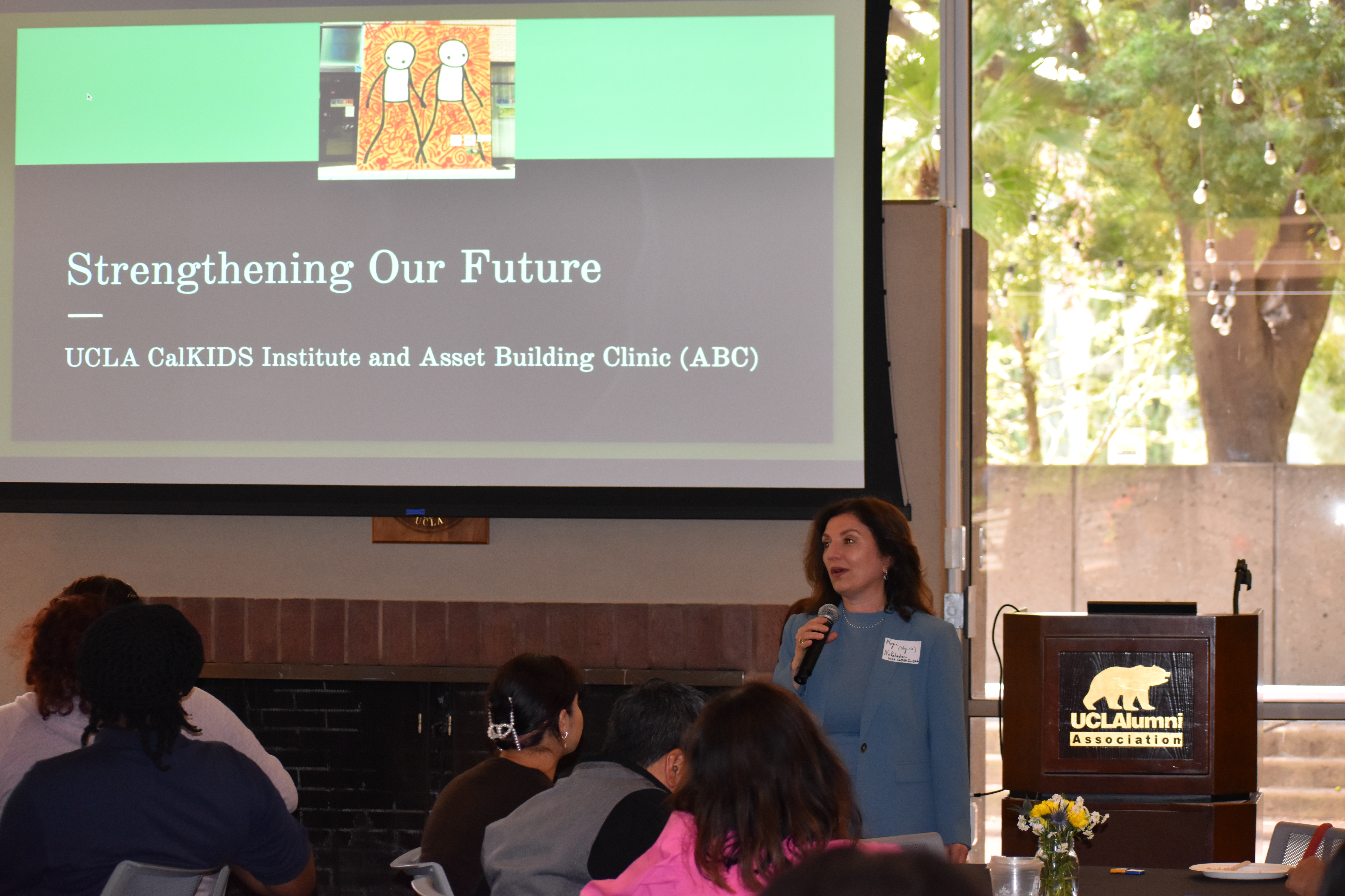 Nahabedian stands in front of guests to deliver opening remarks and shares the importance of the CalKIDS Program.
