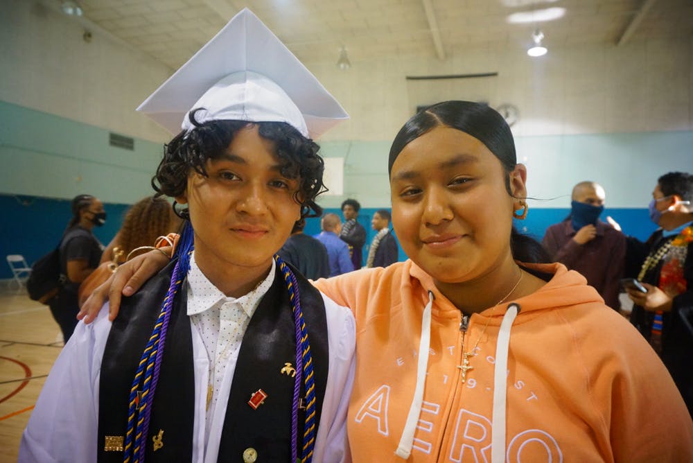 Xavier Alejo, valedictorian for the Mann UCLA Class of 2021, with his sister, Alicia Alejo. Xavier will be attending Loyola Marymount University in the fall. Photo by Darlene Tieu