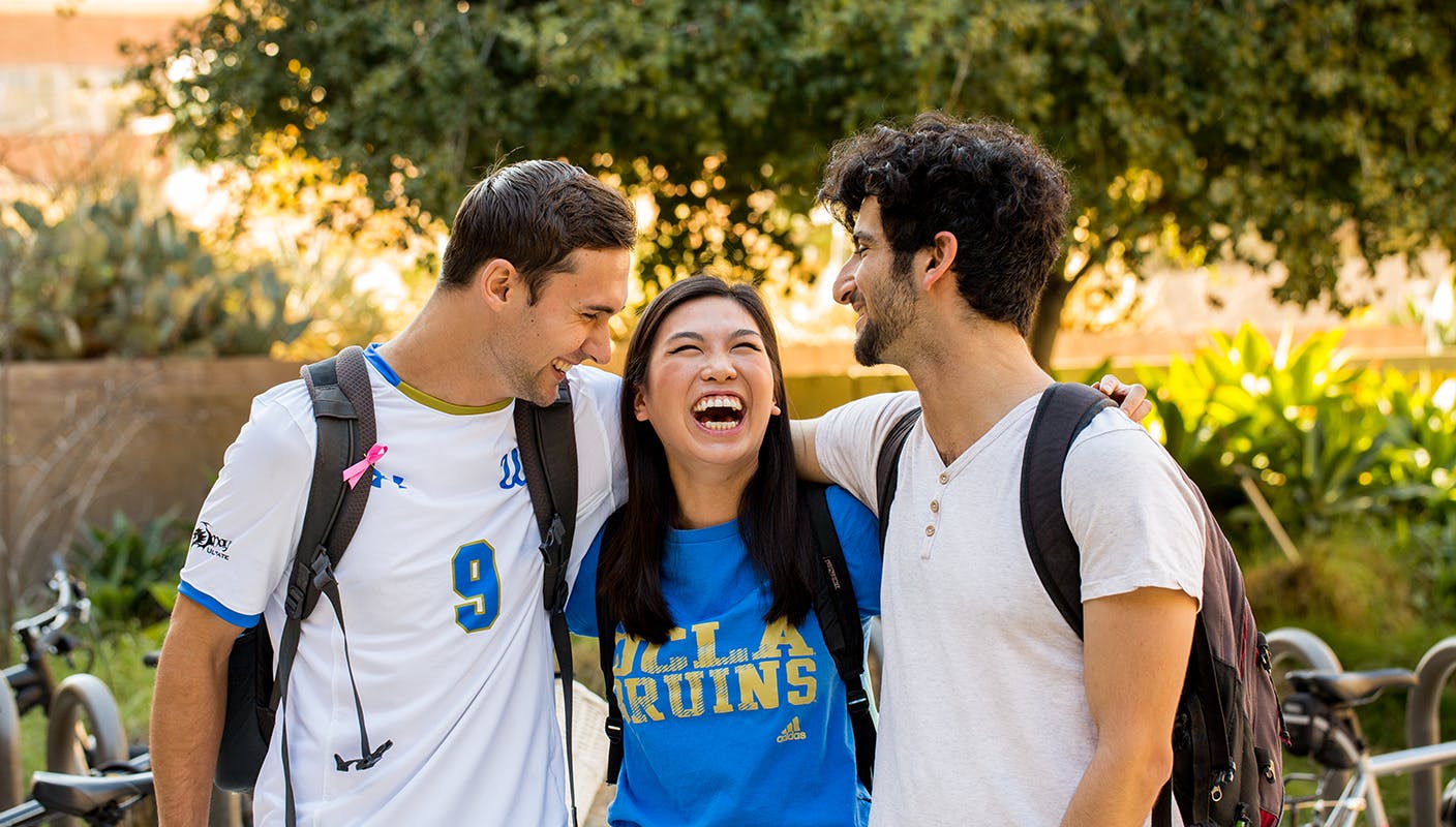 three students laughing