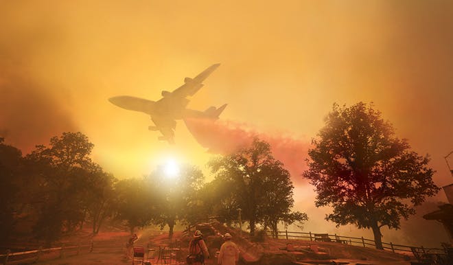 A plane is ascending in the sky, with a trail of red smoke behind the plane. The sky is shades of orange with a white sun in the middle. On the ground there are several trees with two firefighters on a patio looking up at the sky.
