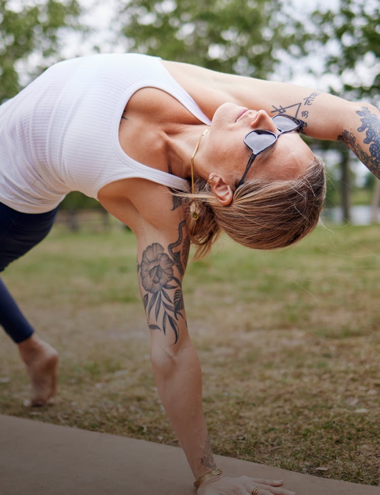 Woman doing yoga in ROKA sunglasses