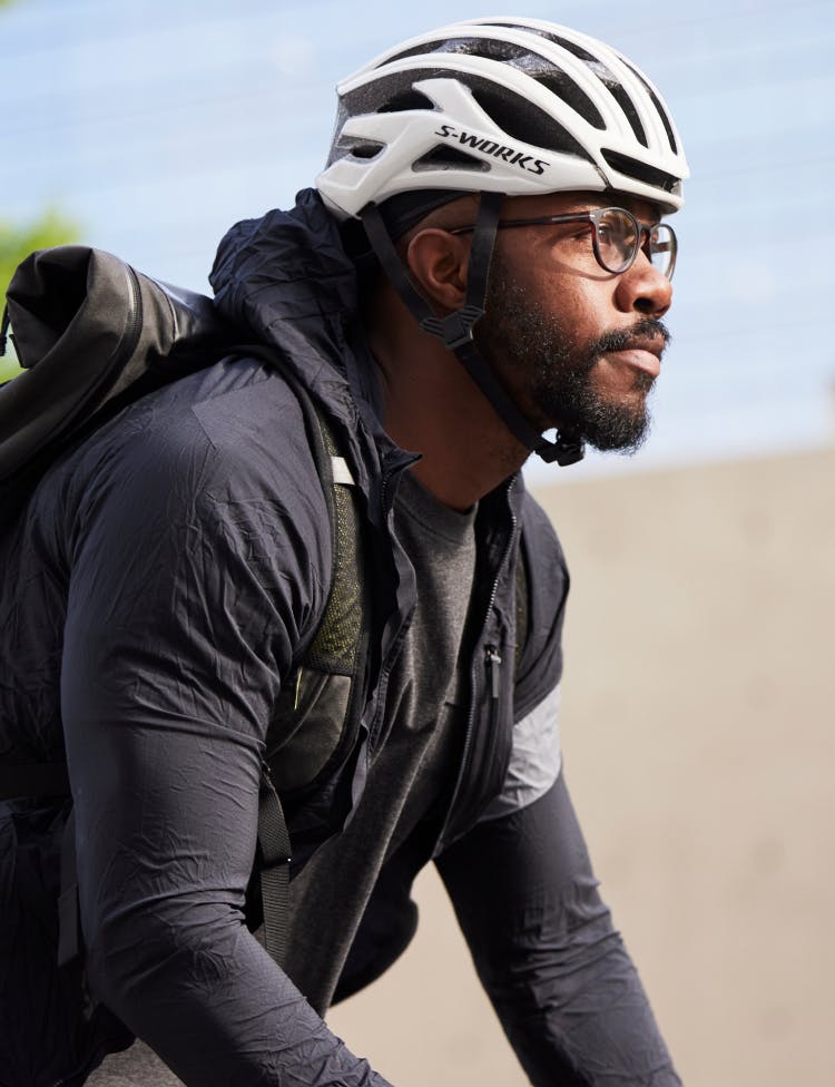 Man cycling wearing ROKA eyeglasses