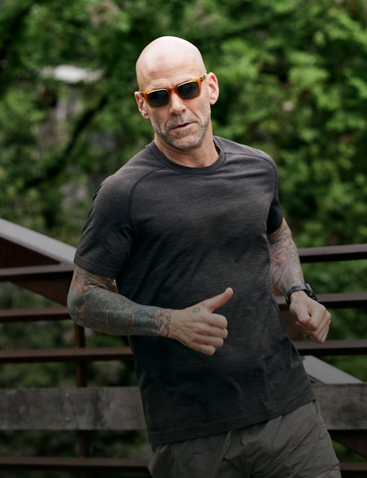 Man running wearing ROKA sunglasses.