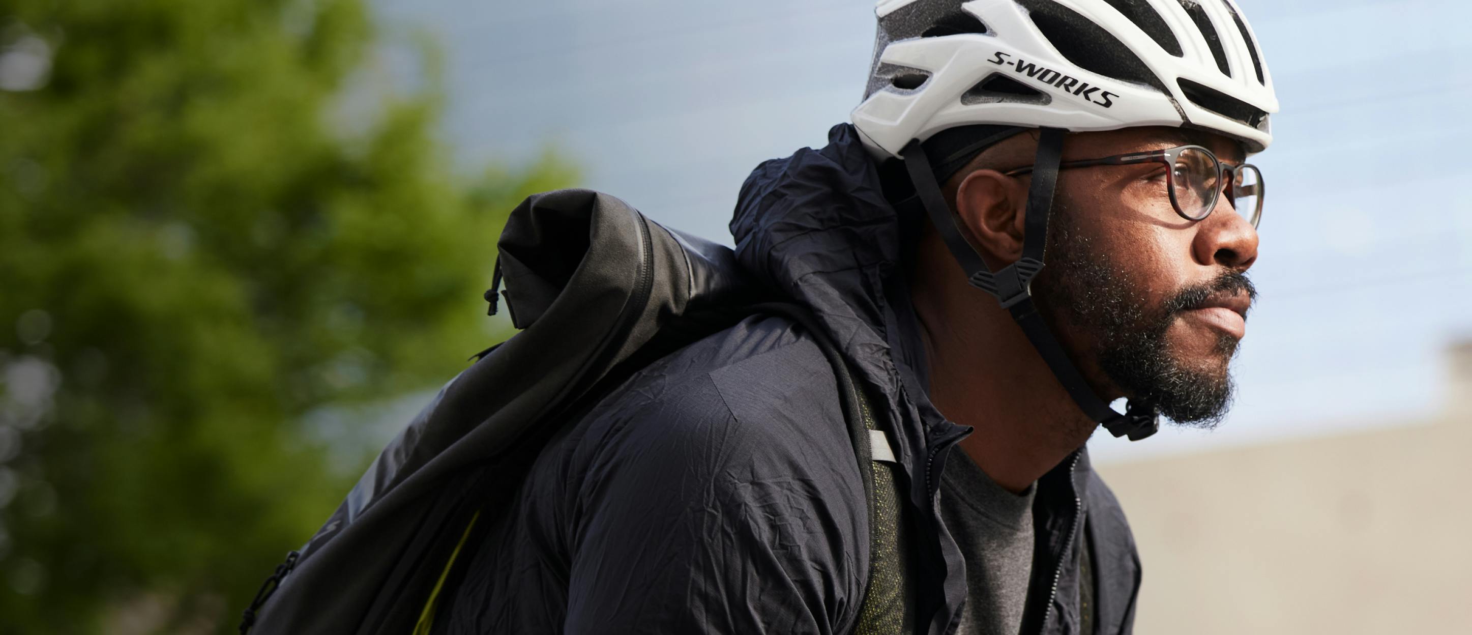 Man cycling wearing ROKA eyeglasses