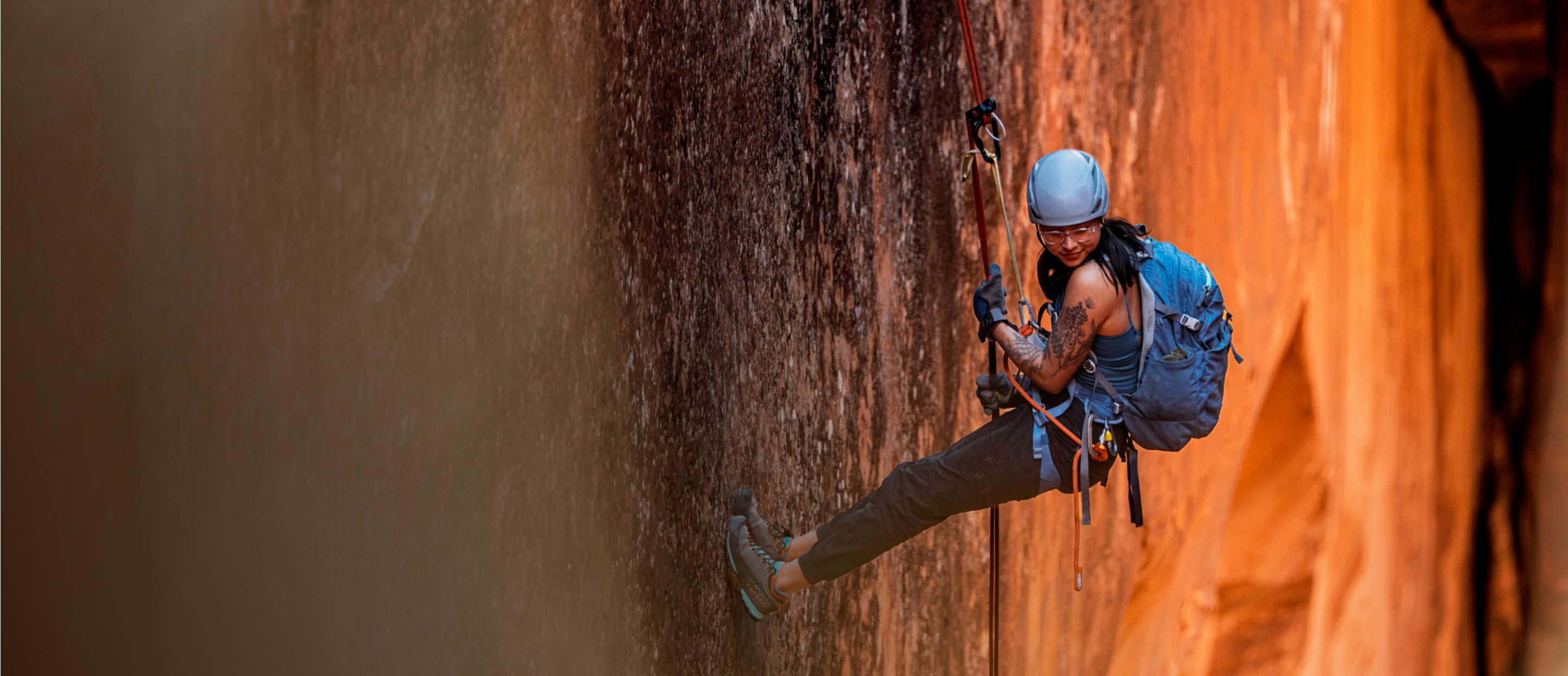 Woman climbing wearing ROKA eyeglasses