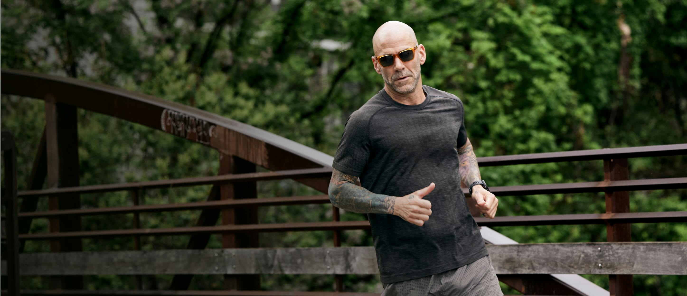 Man running wearing ROKA sunglasses.
