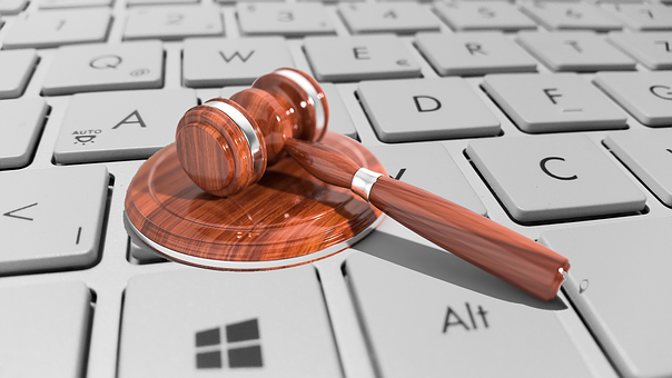 Auctioneers gavel on computer keyboard