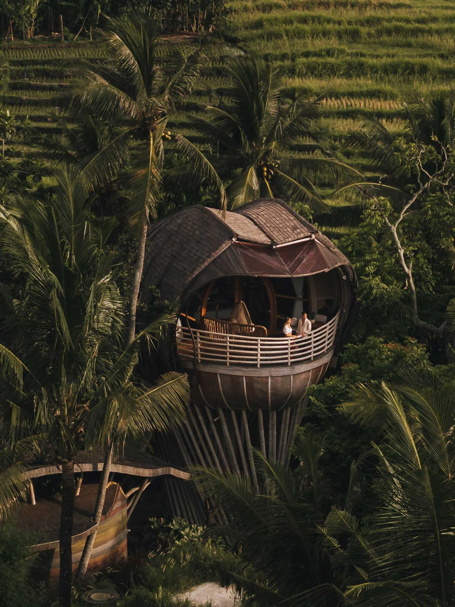 sky villa drone shot with couple on balcony