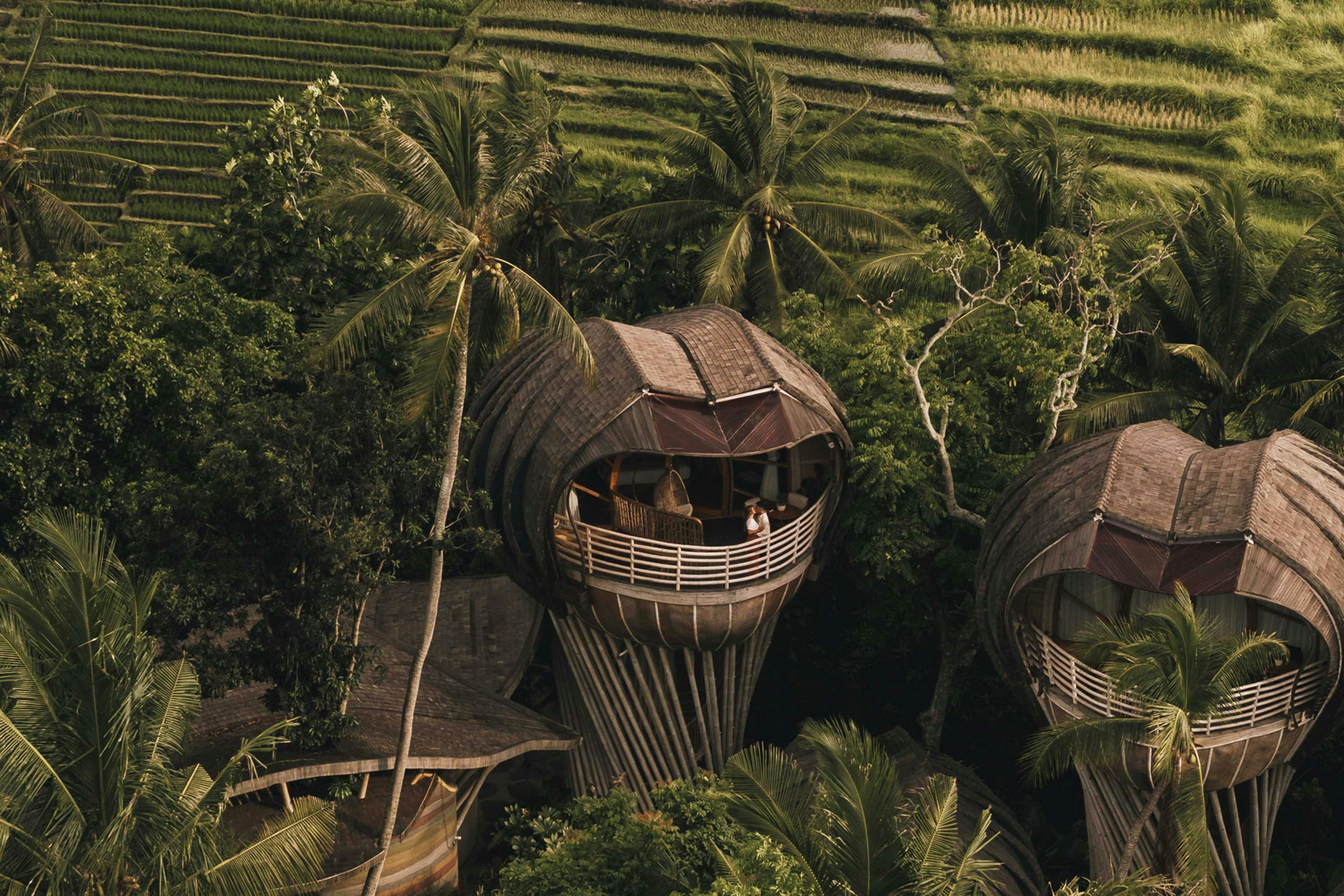 sky villa by drone with couple on balcony