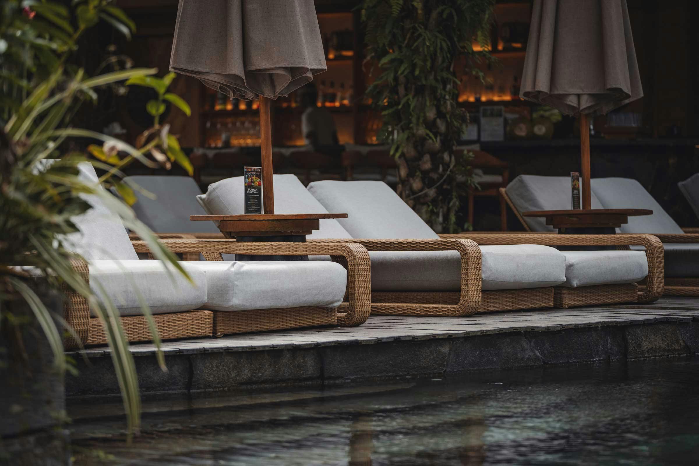 Long chairs by the pool