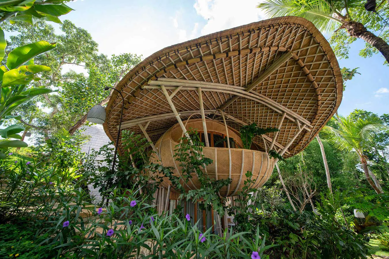 view from the outside of a beautiful luxurious bamboo villa in eco luxury resort in bali