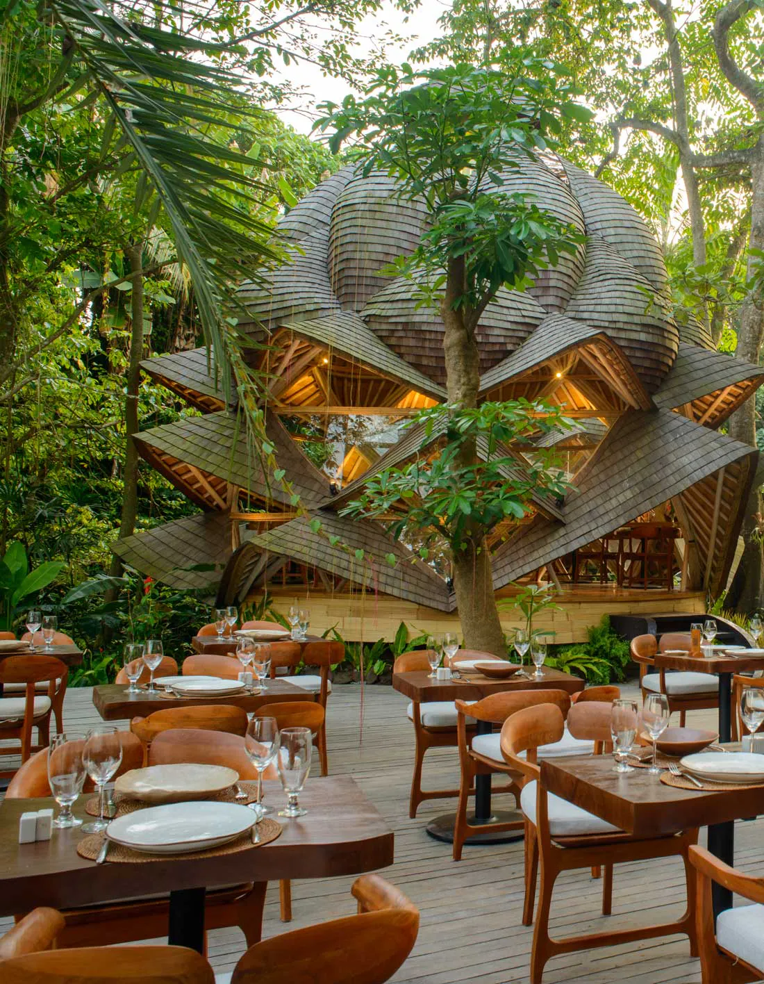 Iconic lotus-shaped bamboo restaurant surrounded by tropical rainforest in Bali, perfect for wedding receptions and private dining events