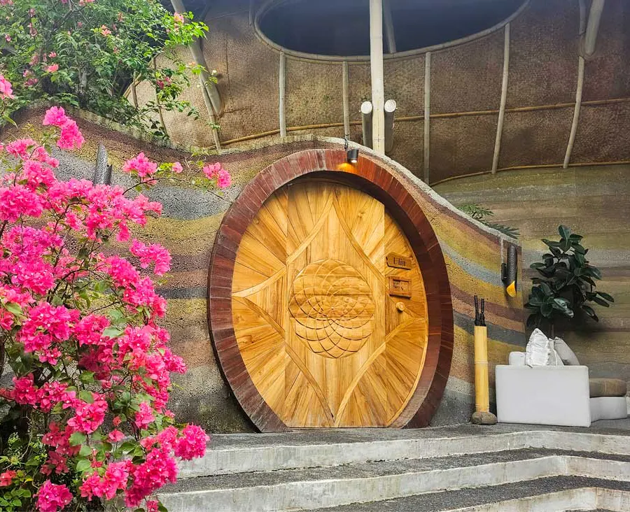 beautiful large wooden door of a eco luxury resort in bali