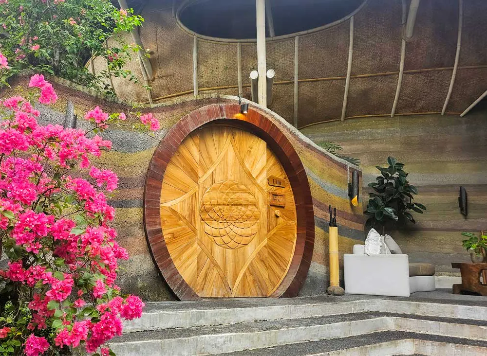 beautiful large wooden door of a eco luxury resort in bali