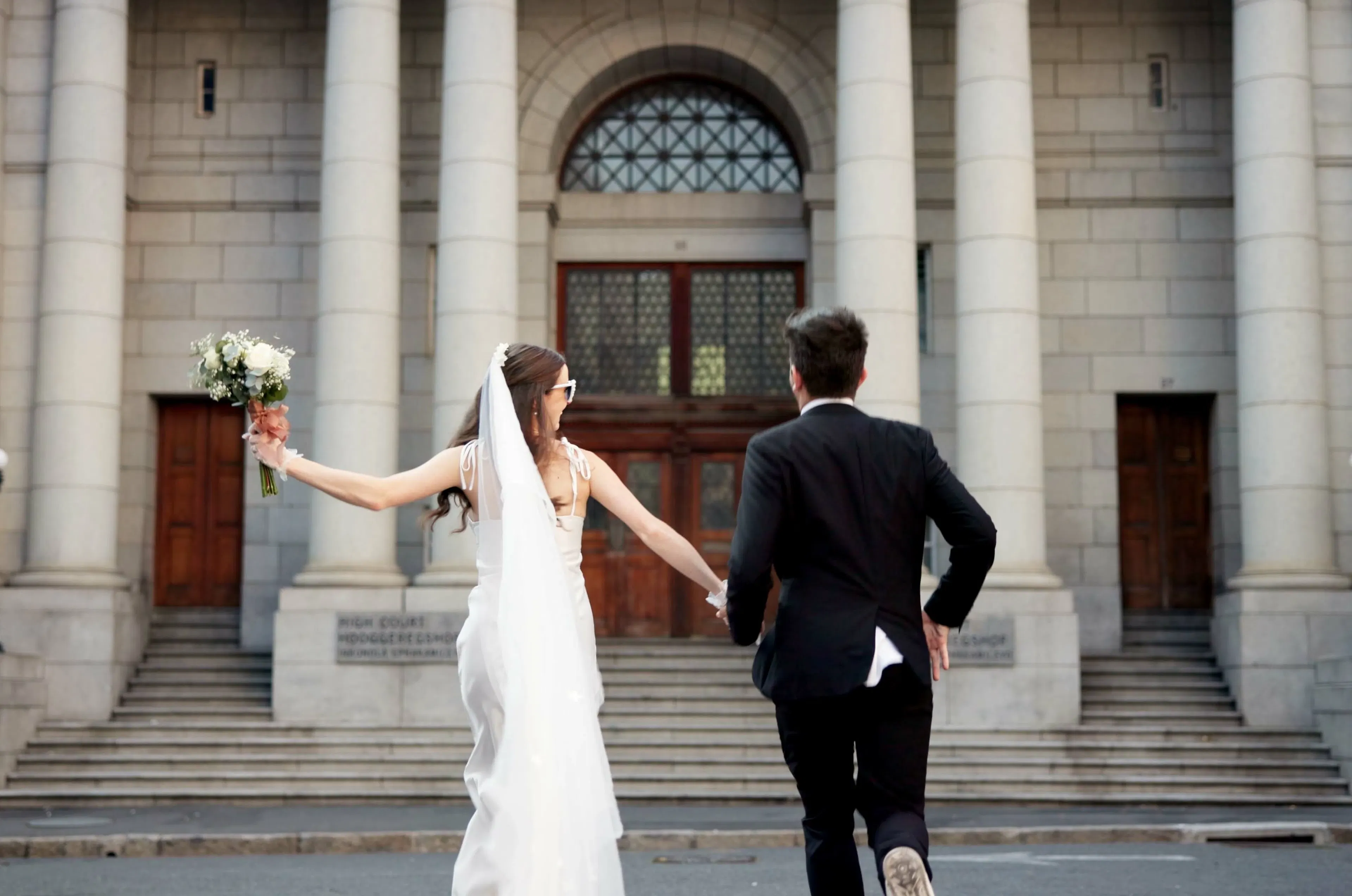 Holding hands, love and man and woman at court for commitment, promise or partnership