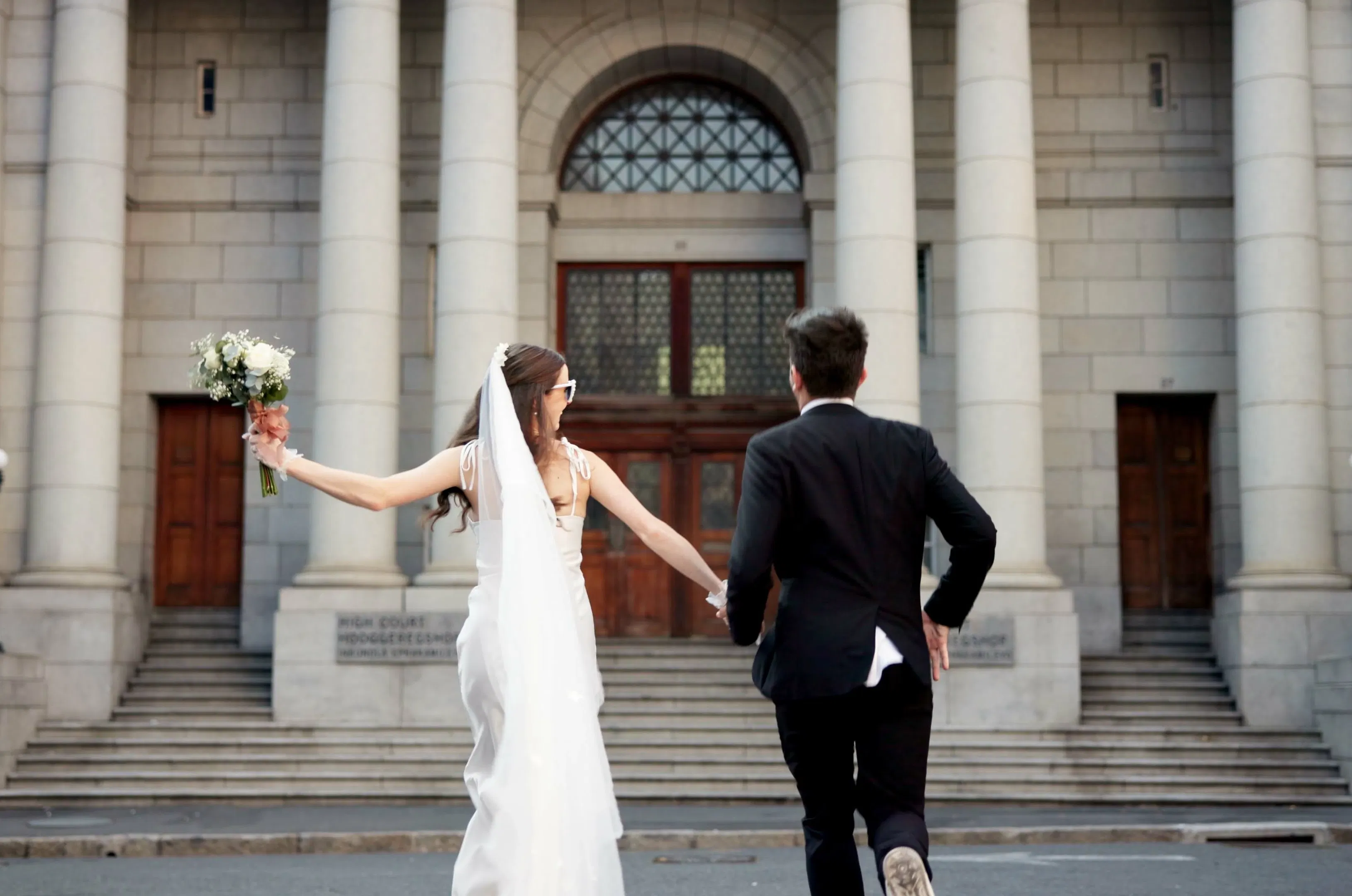 Holding hands, love and man and woman at court for commitment, promise or partnership