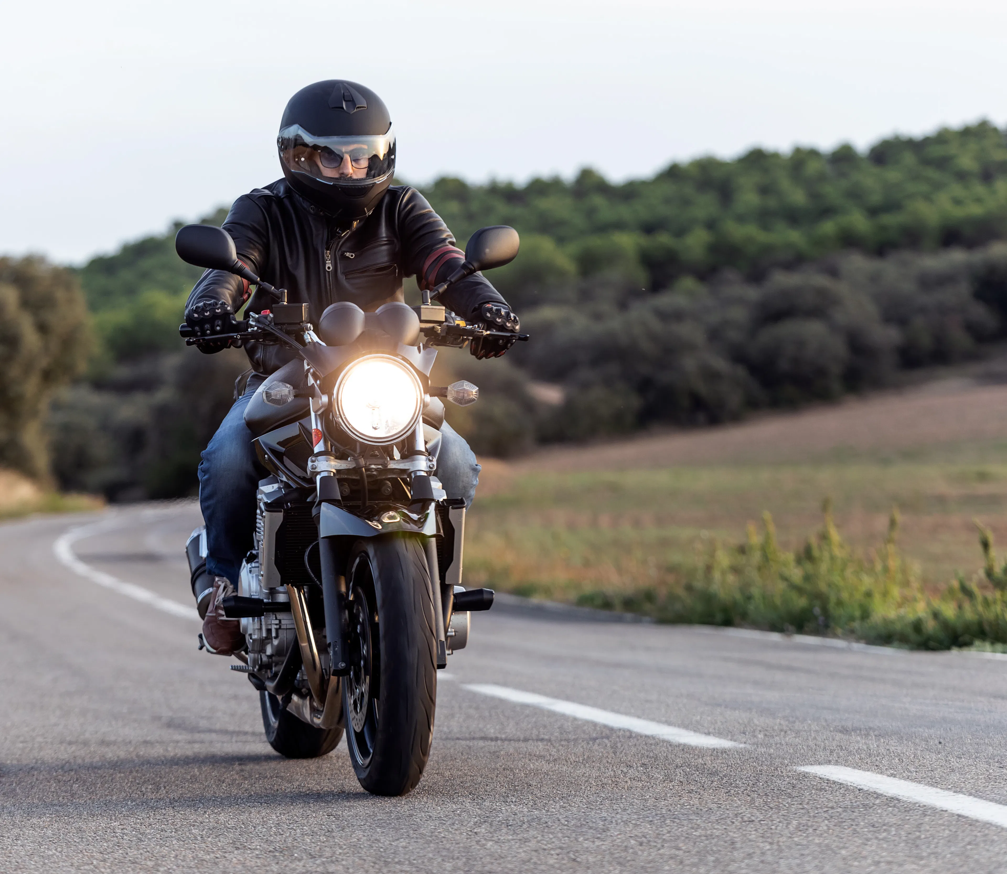 person riding a motorcycle on the road