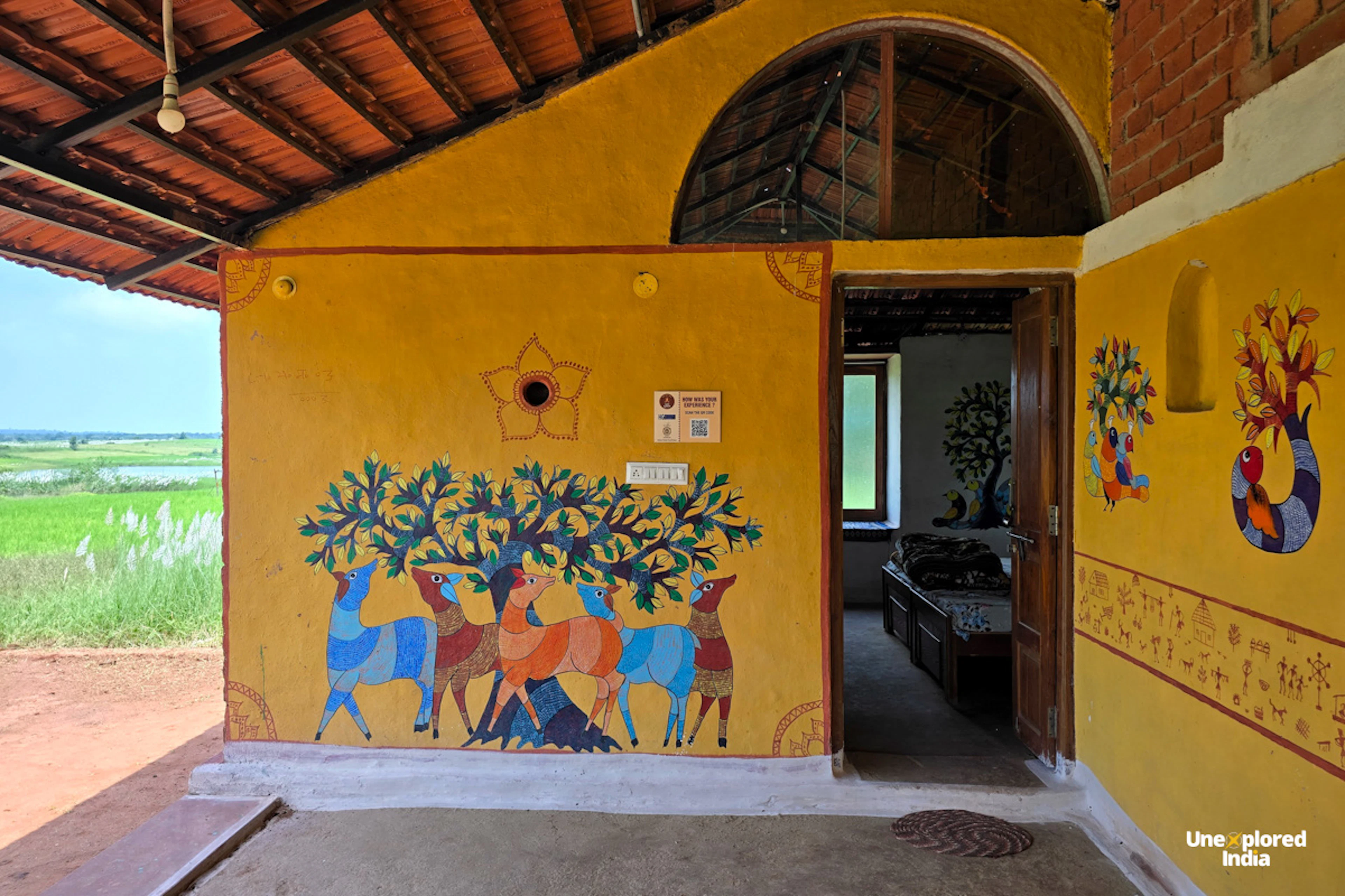 Traditional hand-painted artwork decorating the walls of a village homestay in the Satpura region of Madhya Pradesh  