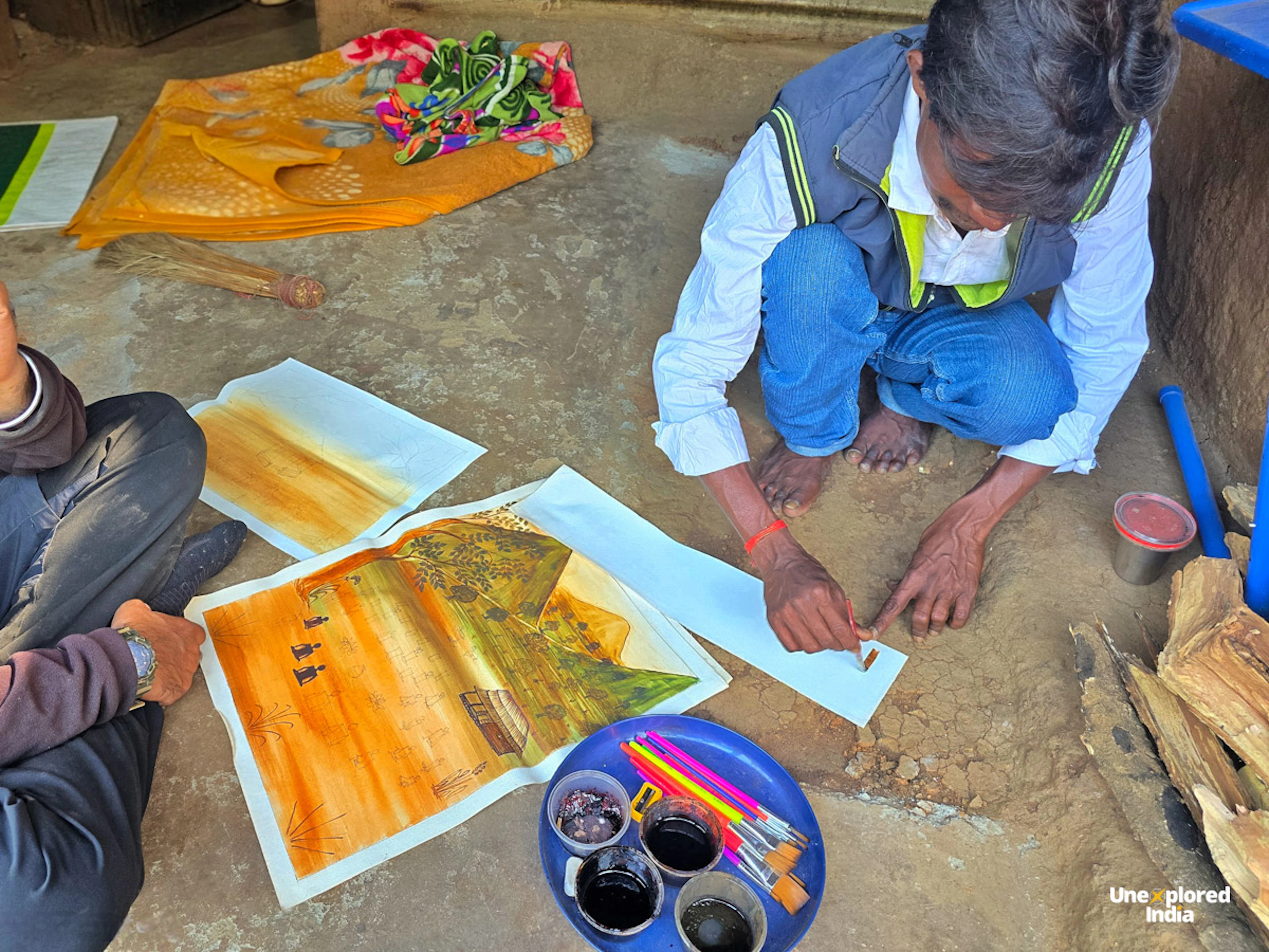 Kurumba painting being created by an artist in the Nilgiris, using natural colours and traditional motifs.