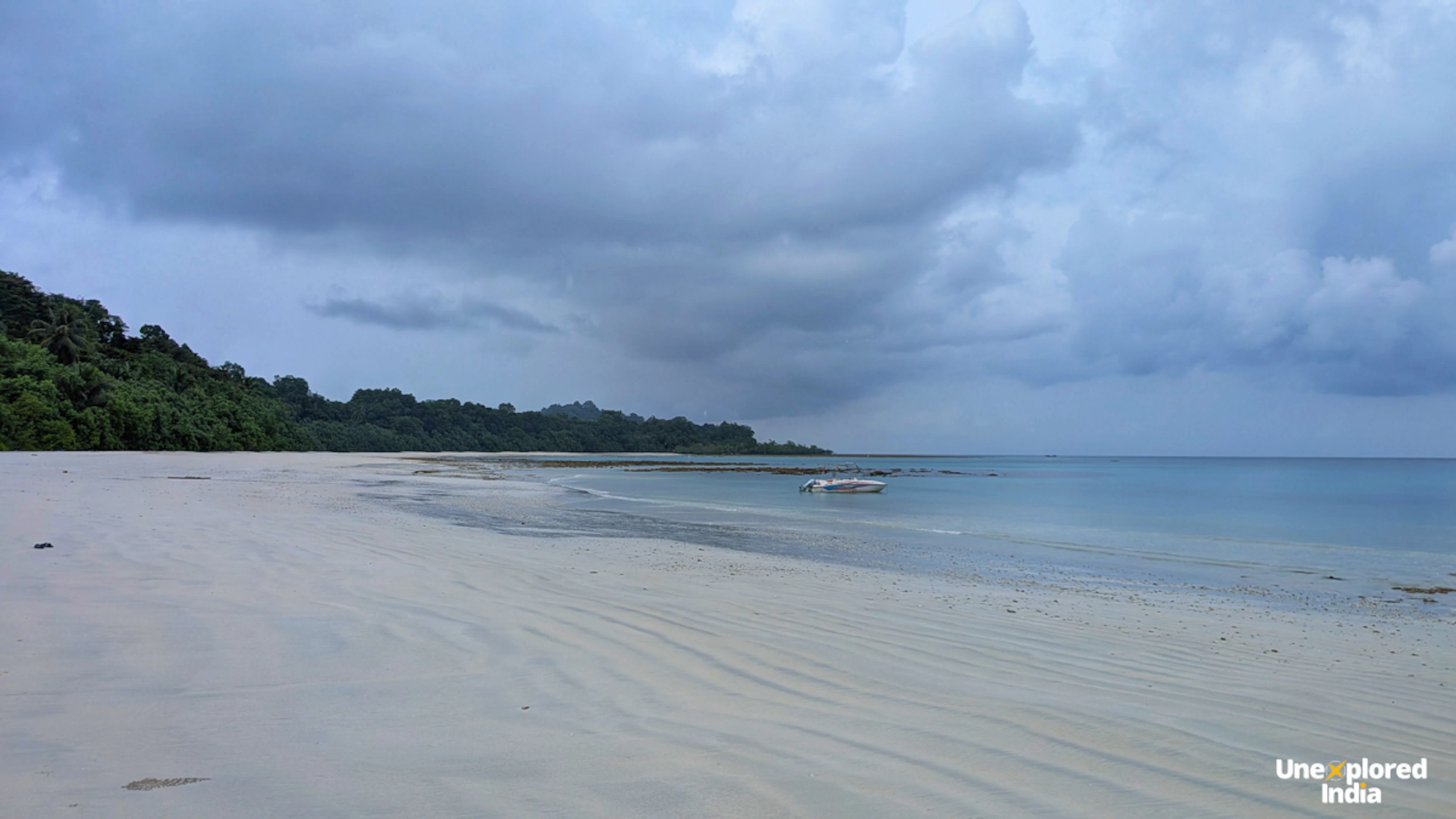 white sand beach and boat from iconic Andaman beaches andaman trip