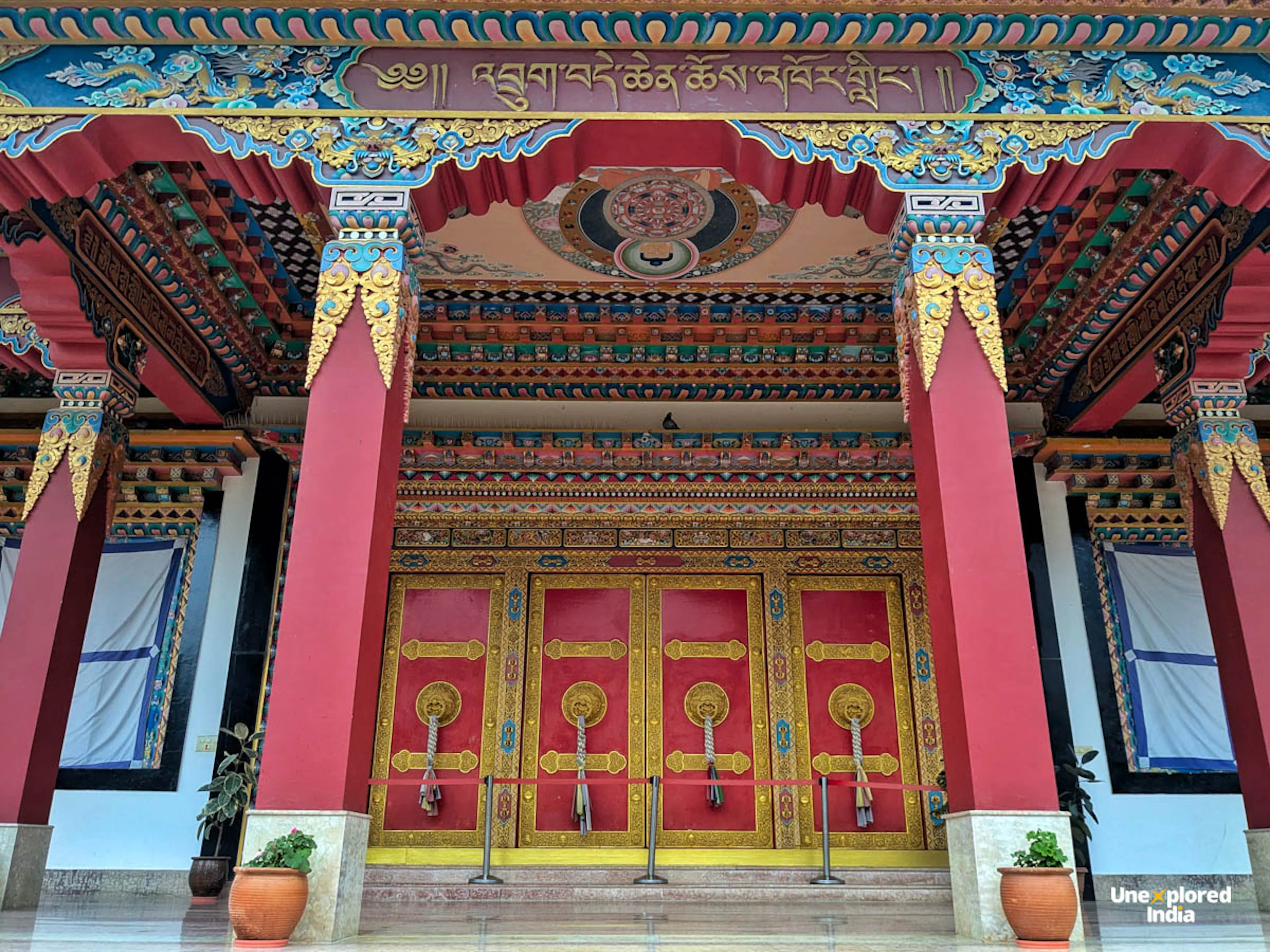 buddhist monastery gateway arch vibrant red