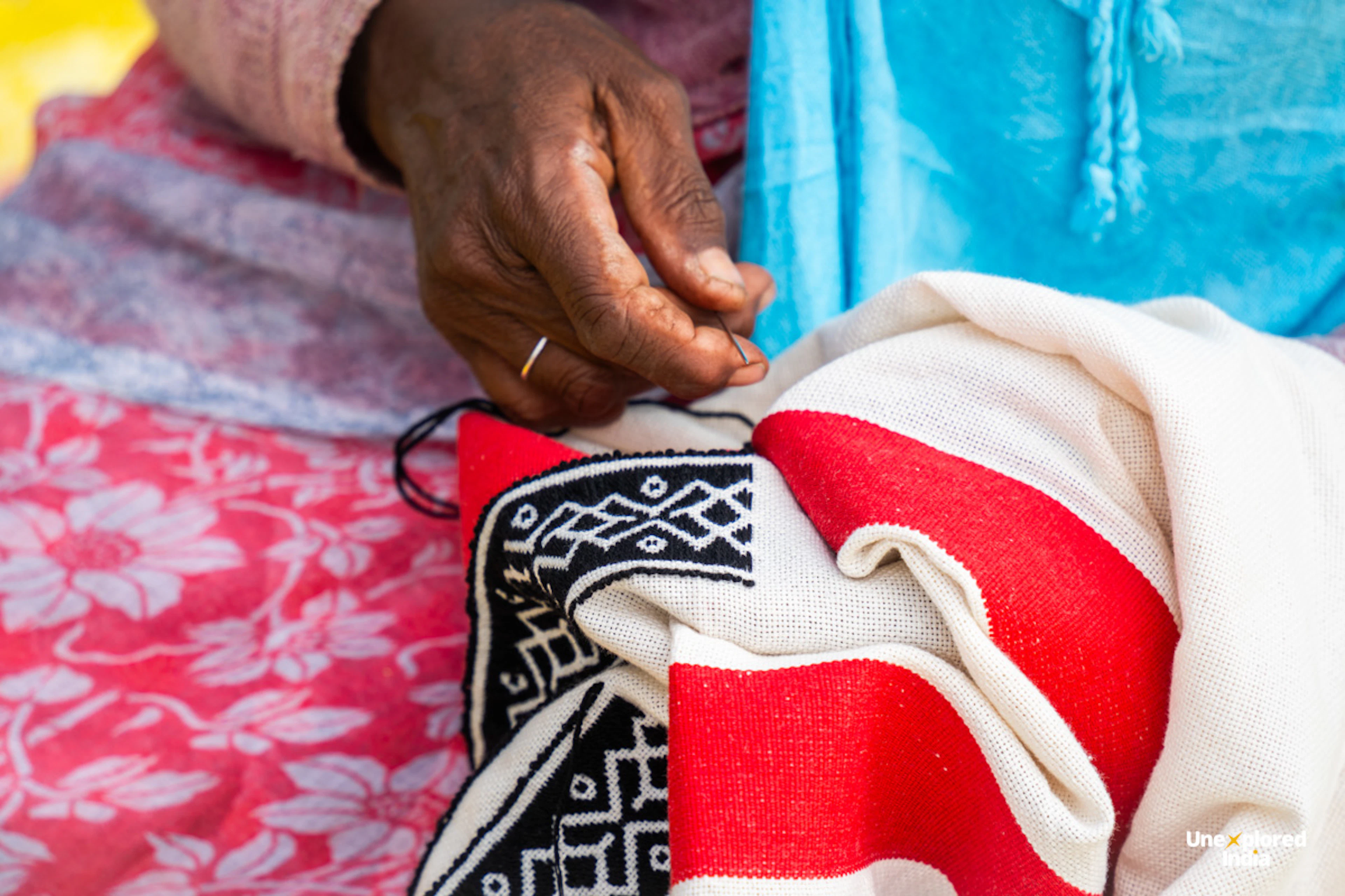 Toda artisan hand embroidering a traditional shawl in the Nilgiris