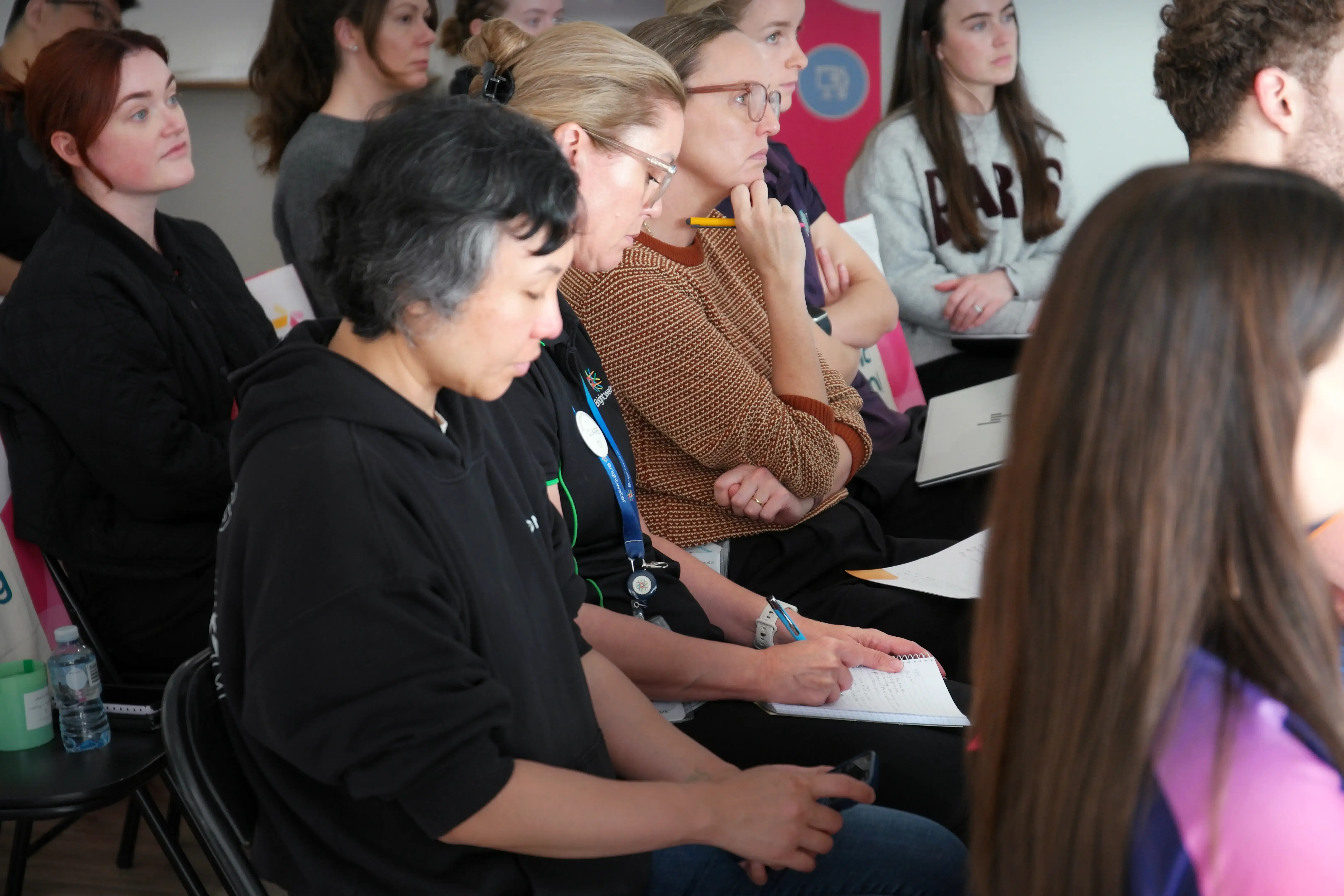 Attendees engaging in professional learning and knowledge sharing at Sana Living.