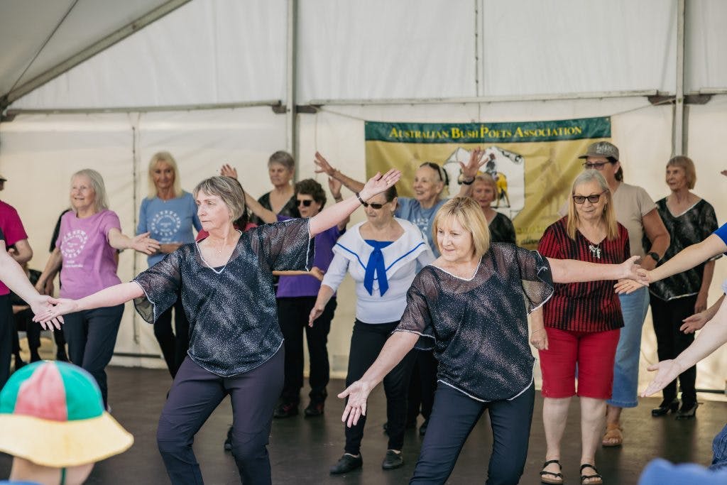 Seniors dance on stage at Have A Go Day Burswood 2023